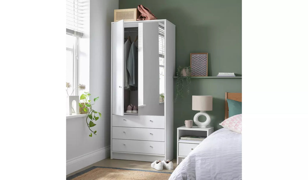 White wardrobe with mirror in a bedroom setting Malibu 2-door wardrobe in white with half mirrored door and 3 drawers

Compact white wardrobe with hanging rail and storage drawers

Home Malibu 2-door 3-drawer wardrobe with mirror panel

Stylish white wood-effect wardrobe with nickel handles and mirror

Bedroom wardrobe with full-width hanging rail and 3 smooth drawers

Modern 2-door wardrobe with mirrored front for small spaces

White Malibu wardrobe with half mirror and practical storage drawers

Space-sav